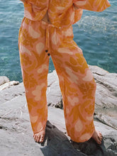 Pantalones sueltos con estampado festivo étnico único